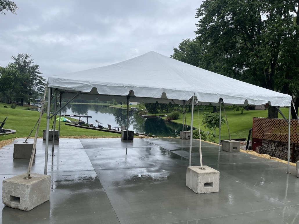 Event tent rental on a patio on a rainy day.