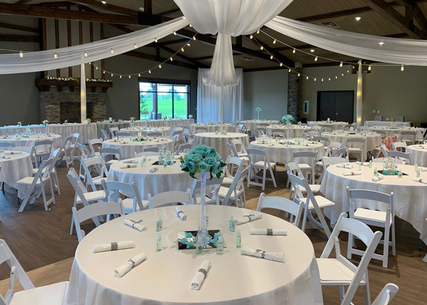 rental-products-on-display Learn about TRU Event Rental’s mission to make your events look like this white and teal flower room.