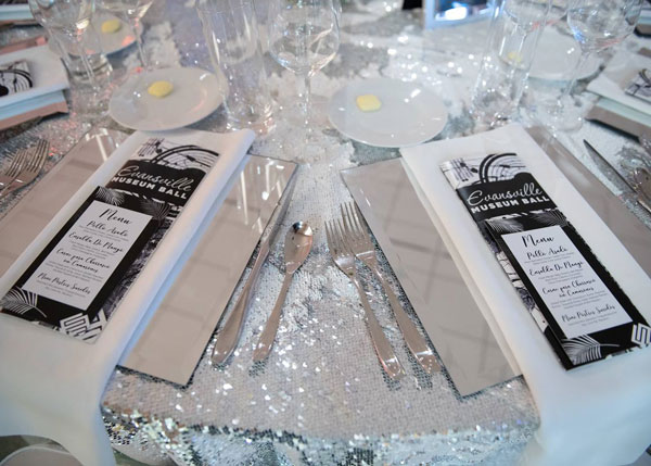 Silverware plates on sequen tablecloth